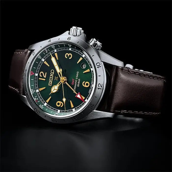 Seiko SBEJ005 Alpinist GMT green dial men's watch angled view leather strap detail