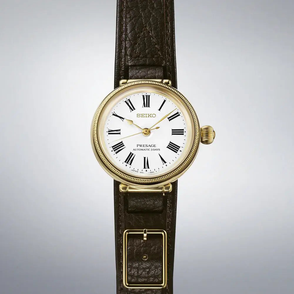 Seiko SARX136 SPB538J1 leather strap watch with white enamel dial close up